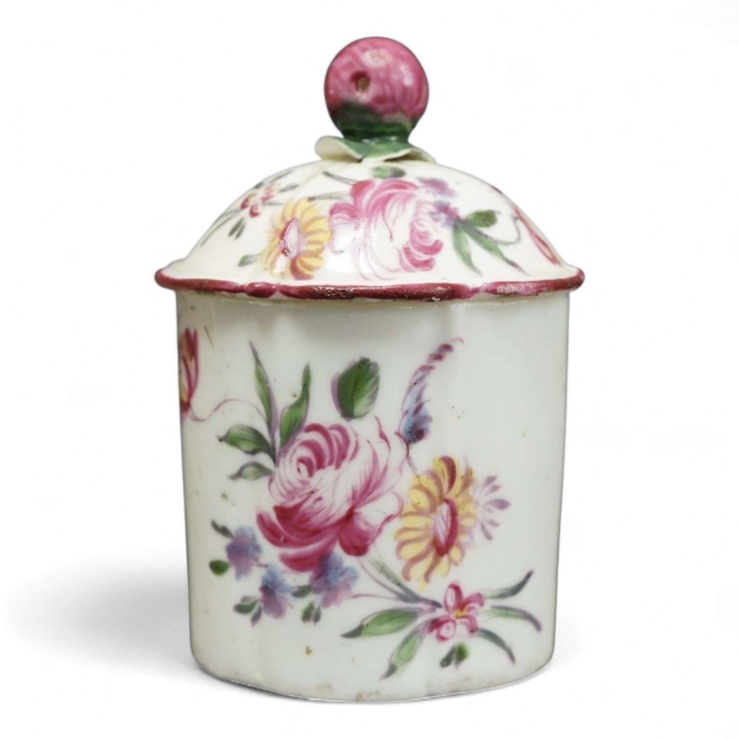 A Mennecy polychrome pomade pot and cover, c.1760, 7.5cm high